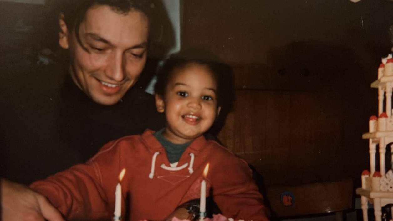Sidney celebrating a birthday as a child